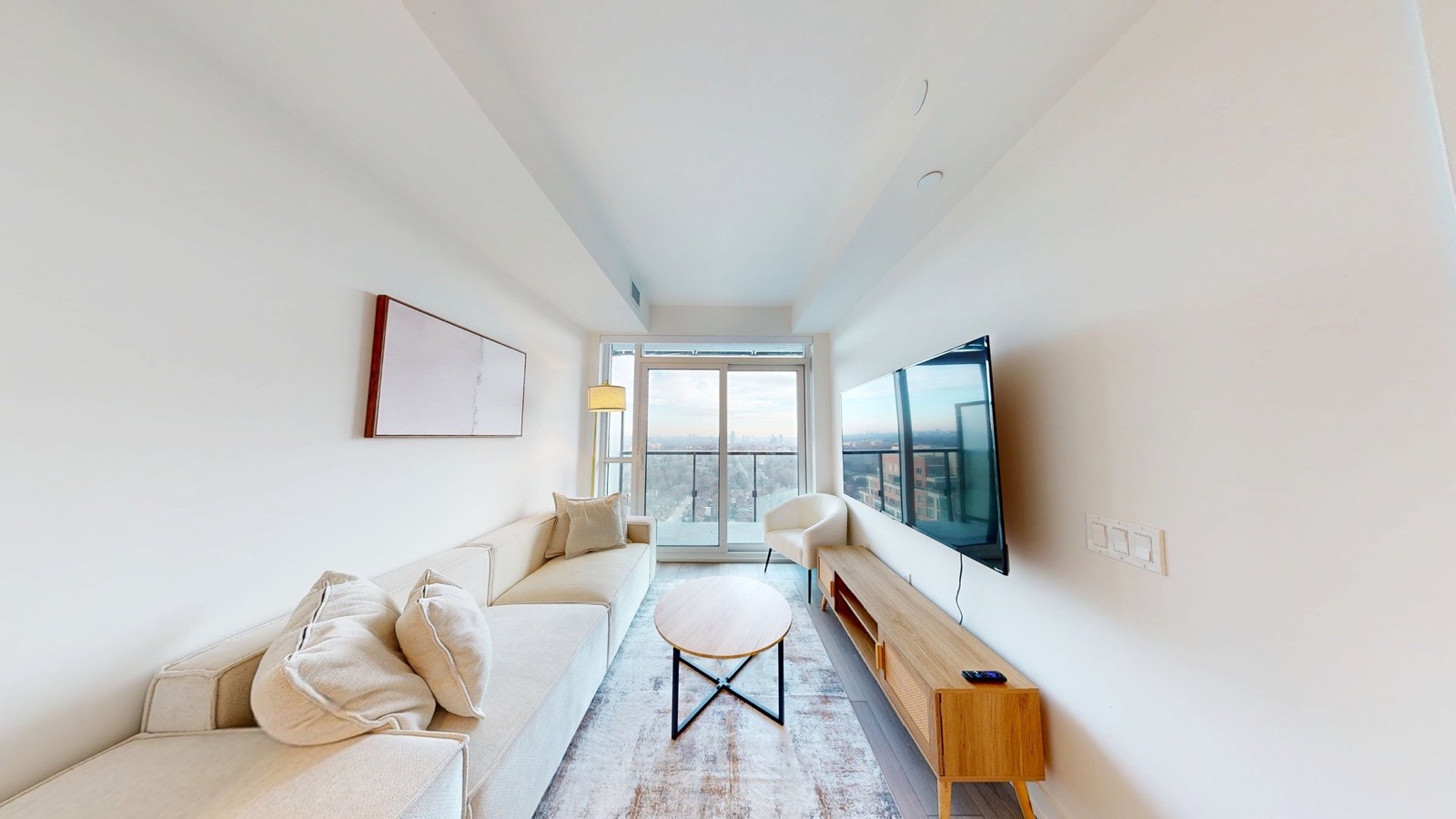 HDR listing photograph of a bright Midtown Toronto condo living room